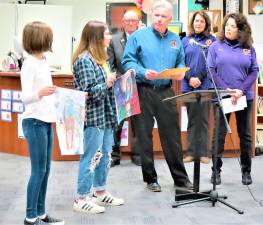 Lions Club poster contest winners Emma Garcia and Kate Huggins were recognized Tuesday night at the Board of Education meeting.