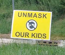 “Unmask Our Kids” signs began popping up on lawns throughout West Milford this summer in reaction to Gov. Phil Murphy’s mandate requiring facemasks for all students as the new school year begins. Photo by Patricia Keller.