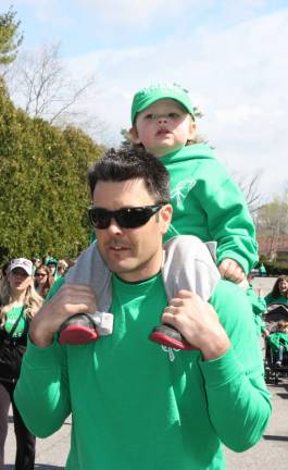 This little one enjoyed a ride rather than a walk.