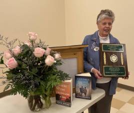 Marty Tappan received a plaque for her 22 years as president of Friends of West Milford Township Library.