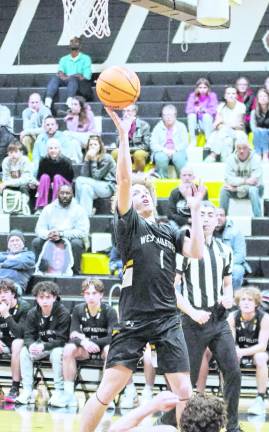 West Milford's John DelVecchio leaps during a shot in the third period. DelVecchio scored 4 points.