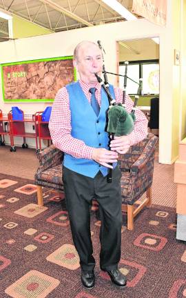 Richard Stillman plays the bagpipes.