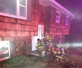 West Milford firefighters combat a house fire on Schofield Road.