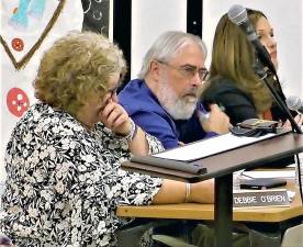 Debbie O'Brien tears up during her final speech on the Board of Education Dec. 18.