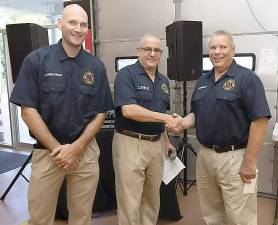 Pictured from left to right are West Milford Fire Chief Joe Corcoran and President Chris DeWilde congratulate Wayne Morrisey. Provided photos.