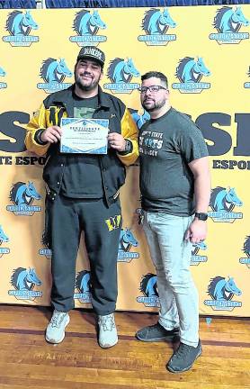 West Milford esports captain Jack Fleming, left, holds a certificate. He is joined by coach Thomas Santoro.