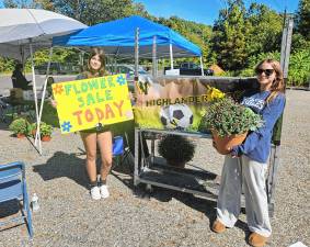 West Milford High School soccer players sell flowers Saturday, Sept. 20 in the upper parking lot of Bubbling Springs Park to raise money for the school’s Soccer Booster Club. (Photo by Rich Adamonis)