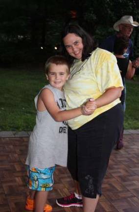 Robbie Pierson, age seven, took to country dancing with his mom, Eileen Pierson.