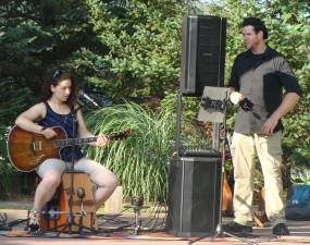 The Harrisons, Jen Sisco and Christian Frentzko, perform at the first concert of the summer at the Amp at the Sussex- Wantage Library.