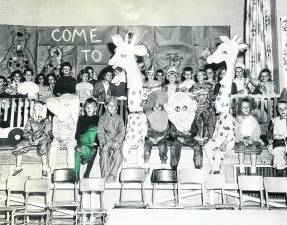 First grade students at Marshall Hill School, West Milford, in 1970 sing “Come to the Circus” (Cy Coleman music and Michael Stewart lyrics) from the Broadway Show “Barnum” as they open the show. Photo: Ann Genader