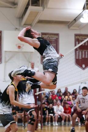 Sean McNally defies gravity in preparation for a kill during game two.