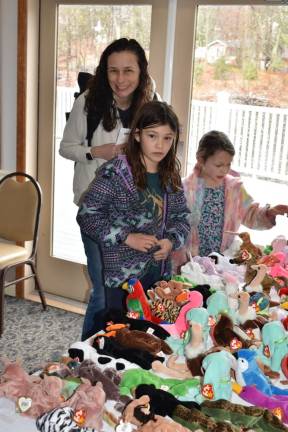 Children look at the Beanie Babies available for adoption.