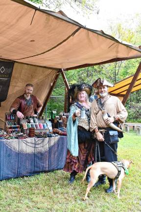 SRF4 Eva and William Whorley of upstate New York with their dog, Taz At left is Colin Maythenwi of Ritual Ops Leatherworks.