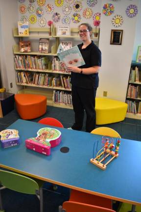 Children’s librarian Pam Zacher says the library has a substantial collection of materials that are educational and fun for children and their parents.