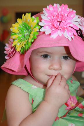 Eighteen-month-old Claire Dolisi was shy yet adorable in her third place bonnet.