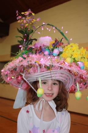 Photos by Ginny Raue Sarah Fillipowicz, 6, lit up the parade. Literally. Sarah took the first place prize.