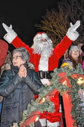 Santa Claus signals for the tree to be lit at last year’s tree lighting.