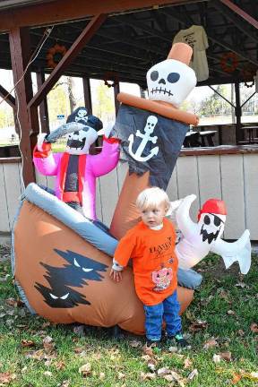 Logan Rathbun of Newton poses with decorations at the Haunted Hawk Hustle 5K on Saturday, Oct. 11 at the Hampton Pit in Newton. (Photo by Maria Kovic)
