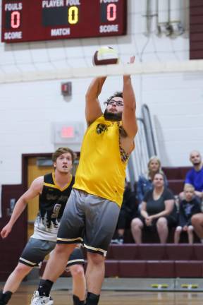 VB8 Mike Paulison of West Milford keeps a Summit serve in play in the first of their two games.