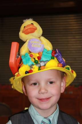 Four-year-old Gavin Hensley was the only boy in the parade. His was a hard hat with power tools. It impressed the judges and took second place in the contest.