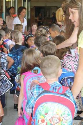 Kindergarten students lined up outside of Upper Greenwood Lake School Wednesday morning, awaiting their first day of school.