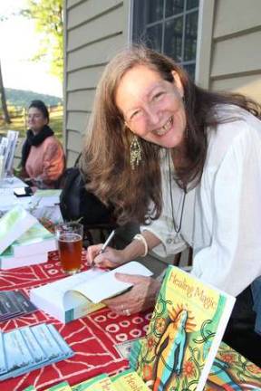 Robin Rose Bennett signing her book "Healing Magic."