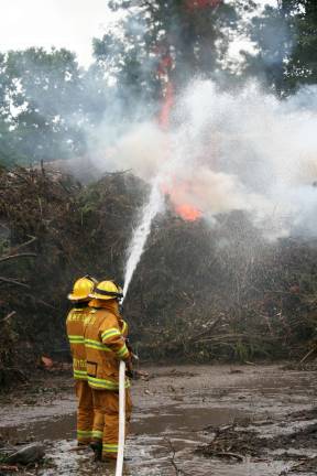 A Labor Day fire at the mulch pile of the Recycle Center brought firefighters from neighboring towns. Photo by Don Webb