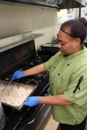 Camp Hope staff prepare food for the veterans luncheon.