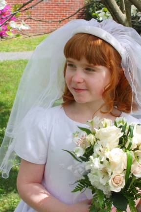 Eight-year old Kelly Carlino looked beautiful for her First Holy communion.