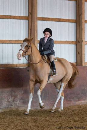 Devon, a sixth grader student at Paradise Knoll, rides her pony.