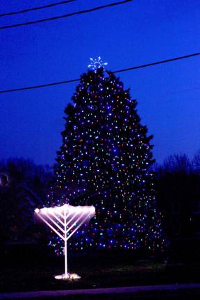 :Holiday lights brighten the night in West Milford. For the first time, the township opened up its holiday display to include faith-based items. Photo by Ginny Raue