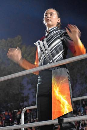 Drum Major Claire Johnson, a West Milford High School senior, conducts the band.