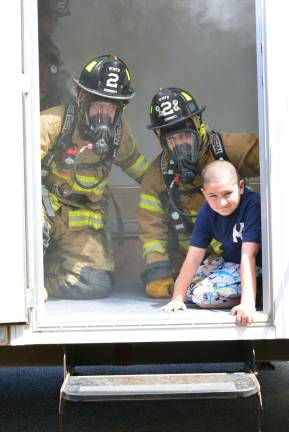 Firefighters 'saved' a young man from a smokey house as part of their demonstration last weekend.