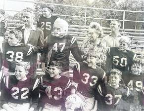 West Milford Mayor Wilbur Fredericks, left, and Township Committee member Mollie McFarland and some West Milford Little Football League team members are seen 60 years ago.