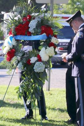The West Milford Police Department representatives presented a wreath in honor of the victims. Photo by Kitty Heuer.