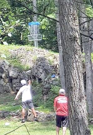 Steve Brinster, who designed the Brakewell Steel course in Warwick Town Park, throws a disc toward a basket during last weekend’s the Hudson Valley’s premiere A-tier disc golf professional tournament. He finished fourth in the men’s division. Photo provided by Christopher Grant.