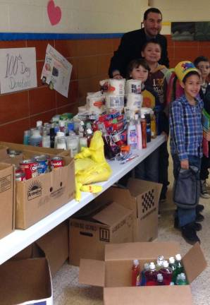 From UGL are student helpers Aidan, Ryan, both in third grade, Ethan from first grade and third grader Luke.