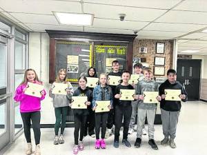 Students, from left, Emma Sarkisian, Gabriella A. Plewa, Aimee Warfield, Maria Azcona, Rebecca Larsen, Evan Weidmuller, Riley Brand, Damon McGlynn, Connor West, Jonathan Flores