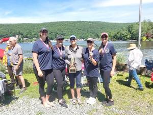 The winning Women’s 4+ team, which had a time of 2:11.4. Pictured left to right: Theresa Taborda, Courtney Britt, Coach Katy Glover, Christine Javenes, and Catherin Hart.