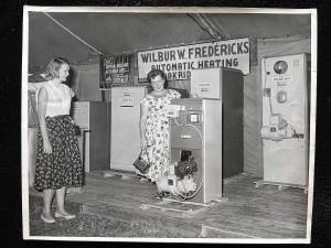 Visitors look at home heating products displayed by Mayor Wilbur Fredericks at the Community Fire Company of Newfoundland and Oak Ridge Country Fair, which ran annually from 1950 to 1994. (File photo by Ann Genader)