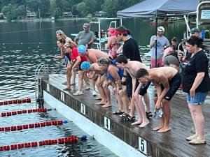 Timers, judges and coaches await the finish of a key race at Lake Wallkill. (Photo by Lori Kane)
