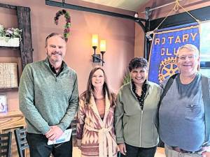 From left, Tom Ziegenbalt stands with recently inducted memers Christine Vanderploeg and Sue Siva, and sponsor Mark Fredericks.