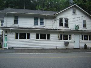 The Struble building in Apshawa offered neighborhood services in the1950s. It housed Floyd and Ann&#x2019;s Bar and Restaurant owned and operated by Floyd Struble and his wife Ann (Romelein) Struble; a grocery store operated by Alfred Struble and his wife Frieda (Vogel) Struble and &#x201c;Fuzzy&#x201d; Struble&#x2019;s automotive shop. Photo by ann genader