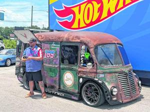 L.J. Koch stands in front of the Luca food truck.