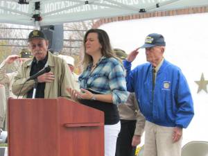 Laura Havrilla leads singing of the National Anthem