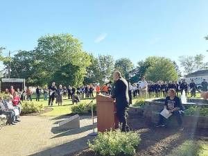 Councilman Michael Chazukow speaks at the 9/11 Memorial Service at the Memorial Park in front of the West Milford Municipal Building. Photo byAnn Genader