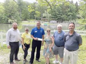 The West Milford Rotary Club presents its check. Pictured left to right: Kenneth Quazza, club President Amy Bennett, Buddy Evans of the YMCA, Bob Asaro, and Chris Garcia.