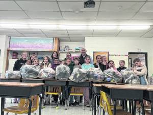 Kids club collects 113 pairs of shoes