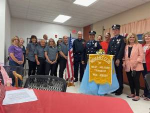 Members of the Woman’s Club of West Milford pose with those who received donations. (Photo provided)