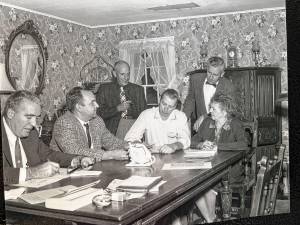 Guests attend a 1950s meeting of the West Milford Historical Society. Seated, from left, are Robert MacLaury, newsman Howard Ball and Leslie Post. Ken Hirsch stands at right. (File photo by Ann Genader)